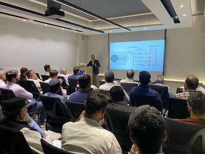 Speaker presenting to audience at seminar